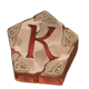 the green knight camelot gold k symbol